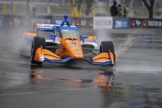 INDYCAR Series driver, SCOTT DIXON (9) of Auckland, New Zealand, travels through the turns during a