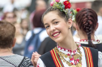 Traditional women's clothing. A young woman in Bulgarian folk costume