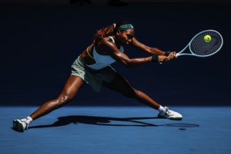 MELBOURNE, AUSTRALIA - JANUARY 19: Coco Gauff of USA hits a backhand to Belinda Bencic of