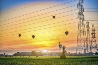 Electric station and air balloons in Luxor at sunrise