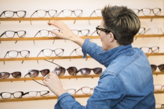 An image of a woman in a eyewear store