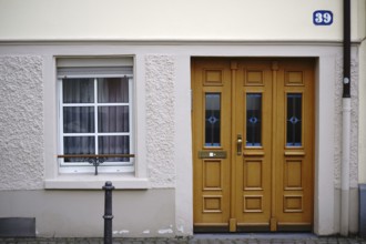The entrance to an old town flat with very low ceilings and a window