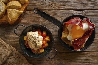 Tapas from spain broken eggs and bravas potatoes