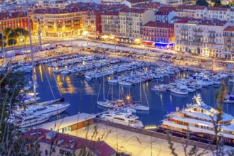 Idyllic view of the harbor, boats and promenade with several cafes, Rade de Villefranche in Nice,