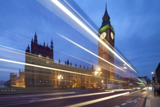 Big Ben in the evening. Dabldekker passes and leaves a line of light at slow shutter speeds.