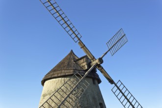 Traditional windmill under blue sky
