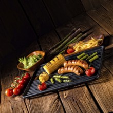 Grilled krakauer with french fries and green salad