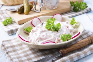 Delicious homemade meat salad with mayonnaise and cucumber