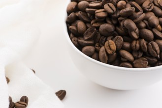 Bowl of caffee beans on a white background