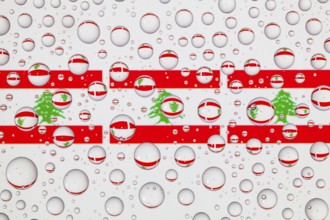 Flags of Lebanon behind a glass covered with raindrops. 3D illustration