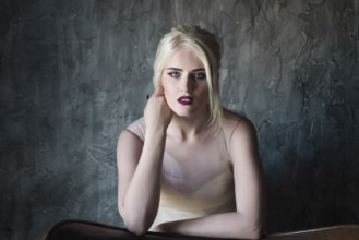 Portrait of beautiful young woman on dark background