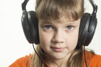 Portrait of a purposeful girl with headphones