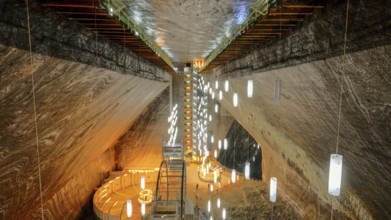 A look inside the historic Salina Turda salt mine with lights in Romania