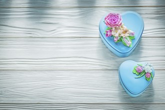 Wrapped gift boxes on wooden board holidays concept