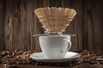 Alternative Coffee Brewing. Corded Paper Filter Holder On White Ceramic Coffee Cup. Coffee Beans On