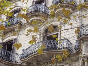 Beautifully shaped balconies on the modernist facade of a residential building, Barcelona,
