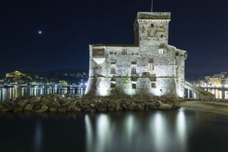 The ancient castle of Rapallo, built on the ligurian sea illuminated by night