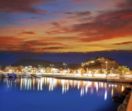 Denia sunset with castle and marina at Alicante in Spain