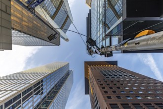 Look up in the morning in the middle of the skyline. Tower blocks and modern glass fronts at