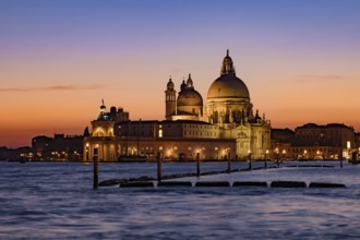 Santa Maria della Salute (Saint Mary of Health) at sunset time, a Catholic church in Venice, Italy,