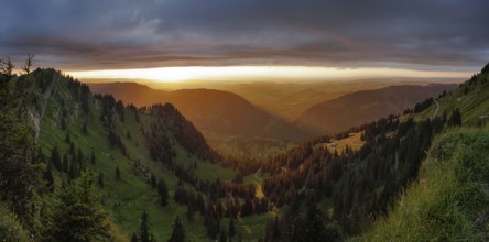 Panoramic view of a light and weather scene over the foothills of the Alps, taken from the