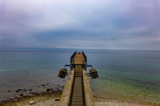 Waterfront and a Pier on Lake Neuchatel in Old Town in a Foggy Winter day in City of Neuchatel,