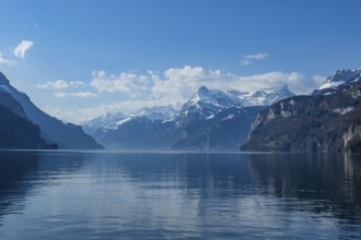 Lake Vierwaldstaettersee, surrounded by snow covered mountains, seen from Brunnen, Switzerland, on