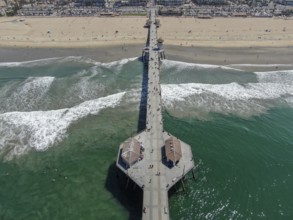 Aerial view of Huntington Pier, beach and coastline during sunny summer day, Southeast of Los