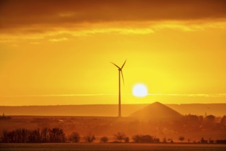 Sunrise with a view of wind turbines and mining heaps from the copper mines in the south of the