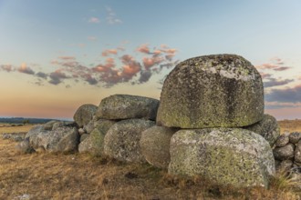 Rocks in the landscape at sunset. Aubrac, France, Europe