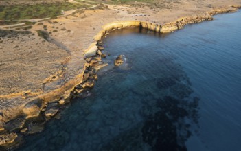 Done scenery of Cape Greko or Cape Greco sea caves Ayia Napa Cyprus. Tourist people doing