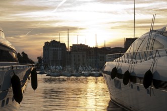 Yachts moored in Cannes at sunset. Cannes bay