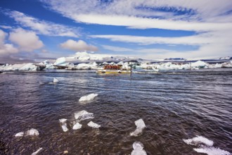 The trash-ice on Jokulsarlon, Iceland. Striped clouds beautifully reflected in the smooth water of