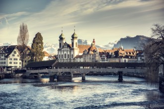 Scenic view on wooden bridge in Lausanne, Switzerland. Mountains and sky with clouds on background