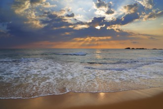 Beautiful landscape with tropical sea sunset on the sand beach