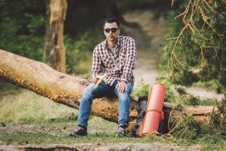 Eating banana Outdoors Hiking Trail. theme hiking and nature travel. Tourist take a rest and eating
