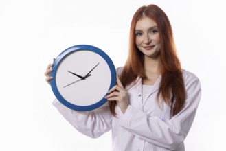 A young woman in a lab coat holds a blue clock, symbolizing effective time management and precise