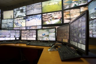 The control room of the city surveillance center. Computer monitors showing the cameras all over