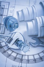 Adjustable key spanner bolts nuts and construction plans maintenance concept