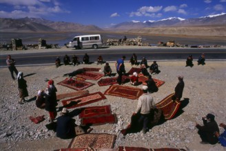 Two small settlements of Kirghiz (Kyrgyz or Kirgiz) nomads lie by the side of Lake Karakul high up