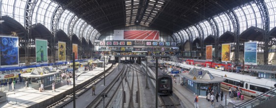 Hamburg, Germany, July 21, 2016: People waiting for trains at the central station, Europe