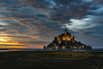 Dramatic sunset on Mont Saint Michel, Normandy, France, Europe