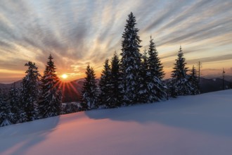 Sunset on the snow plain in the Smrekovica mountains in Velka Fatra