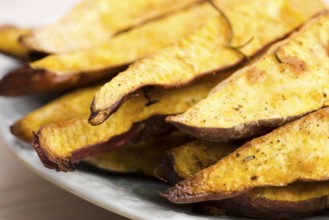 Portion of fresh baked sweet potato wedges, lodz, poland