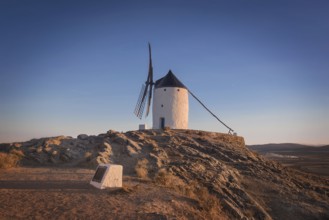 Don Quixote windmills at sunset. Famous landmark in Consuegra, Toledo Spain