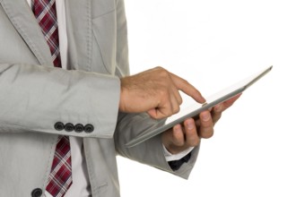 A manager or entrepreneur holds a tablet computer in his hand Austria
