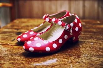 Red dance shoes with white dots