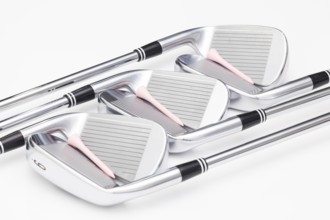 Titanium golf clubs on the white background