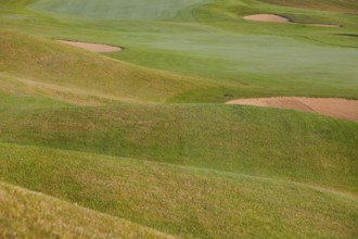Summer golf course with different bunkers