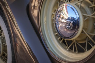 Lisbon, Portugal - Sep 29, 2024: Close-up and selective focus of spare wire wheel and wheel center